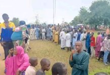 Long queue of people waiting to buy the subsidized food.