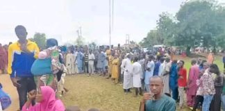 Long queue of people waiting to buy the subsidized food.