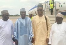 Adamawa APC chairman flanked by state officials of the party upon arrival at Yola Int'l airport, Tuesday.