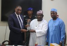 Right: Mr. Arabi Dasuki, DG. Bureau of Public Service Reforms presenting Award of best performing Federal Government Agencies in 2022 to Dr. Bello Maigari, Exec. Sec. National Lottery Trust Fund as the best performing Agency.