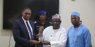 Right: Mr. Arabi Dasuki, DG. Bureau of Public Service Reforms presenting Award of best performing Federal Government Agencies in 2022 to Dr. Bello Maigari, Exec. Sec. National Lottery Trust Fund as the best performing Agency.