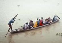 File picture of people crossing a river in a boat.