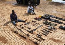 The arrested suspects and weapons.