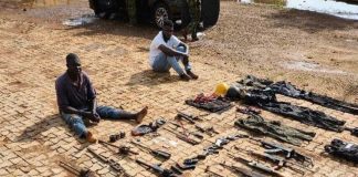 The arrested suspects and weapons.