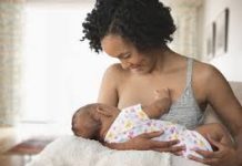 Filed picture of a breastfeeding mother.