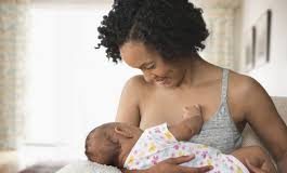 Filed picture of a breastfeeding mother.