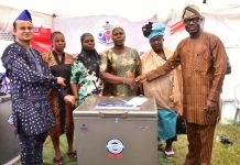 Dangote Cement Ibese Plant Director, Azad Nawabuddin (left) and Permanent Secretary Ogun Ministry of Industry, Trade & Investment, Dr. Aikulola Olu-Ola (right) with some of the Women beneficiaries of the Women Empowerment Scheme at the 2023 Dangote Cement Ibese plant Community Day Celebrations, held at Ibese, Ogun state.