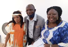 Presentation of the land papers to one of the lucky staff.