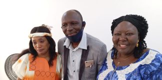 Presentation of the land papers to one of the lucky staff.