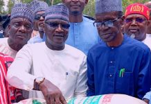 Sen. Amos during the distribution of the items.