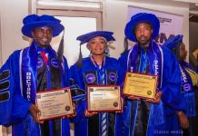 The governor's aide with others after the induction.