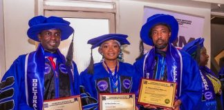 The governor's aide with others after the induction.