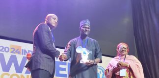 The executive chairman of Adamawa State Primary Healthcare Development Agency Dr. Sulaiman Bashir receiving the award in Abuja.