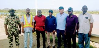 The director of dams and reservoir operations with members of his team during the facility tour of Kiri Dam on Thursday.