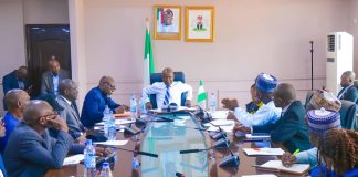 The minister with officials of the ministry during one of the dept'l briefings.