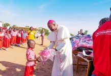 Bishop Mamza during the distribution of the school materials at Missio primary school Damare on Thursday.