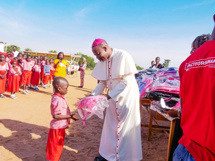 Bishop Mamza during the distribution of the school materials at Missio primary school Damare on Thursday.
