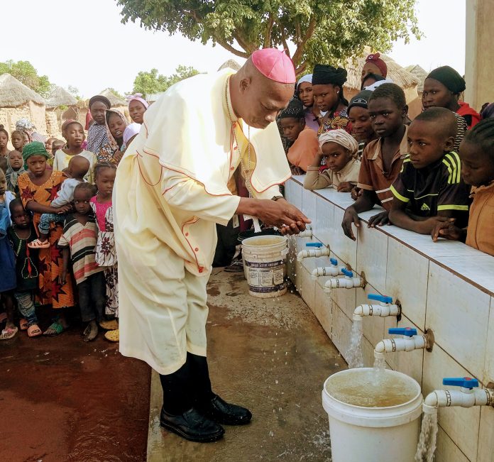 Bishop Mamza commissioning the water project undertaken by JDPC and Mission Take Heart at Tashar Turmi on Friday.