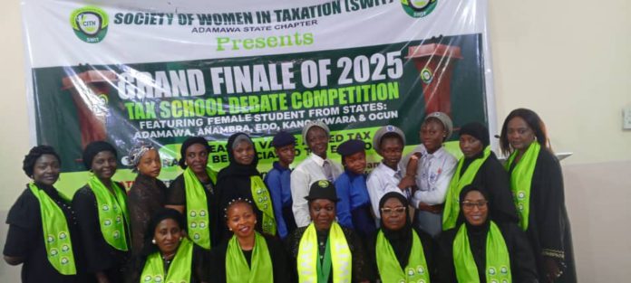 Group picture of officials and students shortly before the SWIT National Zonal tax debate commences in Yola on Thursday.