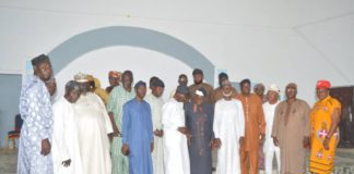 Group photo of key stakeholders during the town hall meeting at Numan.