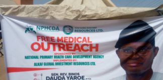The banner of the free medical outreach in display.