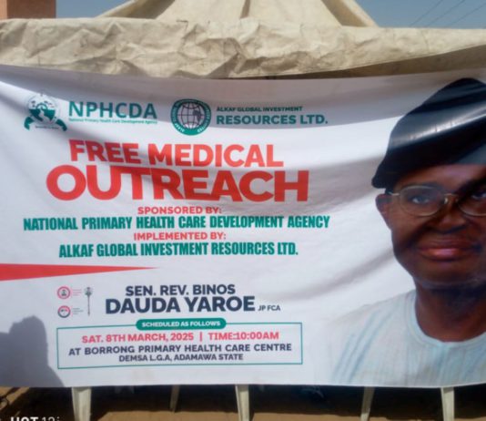 The banner of the free medical outreach in display.