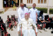 Bishop Mamza mounted one of the wheelchairs to showcase its strength during the distribution of 93 wheelchairs to PLWD on Tuesday in Yola.