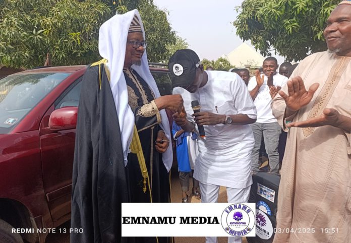 The national coordinator of Emnamu Foundation, Godwin Chakuyada presenting the car keys to Malam Ahidjo on Thursday.