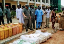 Garba Bashir, Adamawa/Taraba area commander of NCS inspecting some of the seized items on Tuesday at Customs house, Yola.