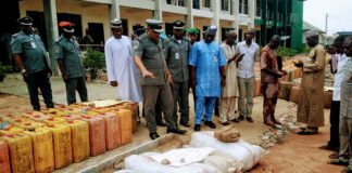 Garba Bashir, Adamawa/Taraba area commander of NCS inspecting some of the seized items on Tuesday at Customs house, Yola.