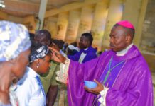 Bishop Mamza applying ash to congregants to mark the commencement of Lenten.