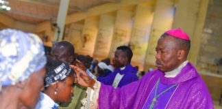 Bishop Mamza applying ash to congregants to mark the commencement of Lenten.