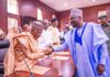 Sulaiman in a handshake with gov Fintiri after he was sworn-in as commissioner of works and energy development in Adamawa.