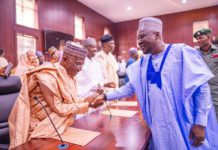Sulaiman in a handshake with gov Fintiri after he was sworn-in as commissioner of works and energy development in Adamawa.