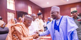 Sulaiman in a handshake with gov Fintiri after he was sworn-in as commissioner of works and energy development in Adamawa.