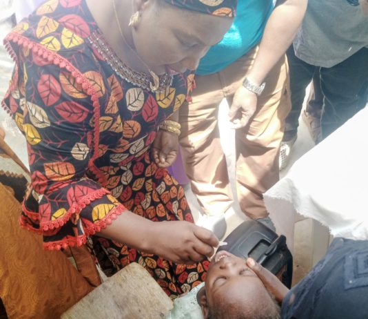 Yola North LG vice chairman, Sarah Nathan administering the two doses of the vaccine on a child during the flag off of the campaign in Yola North on Sunday.