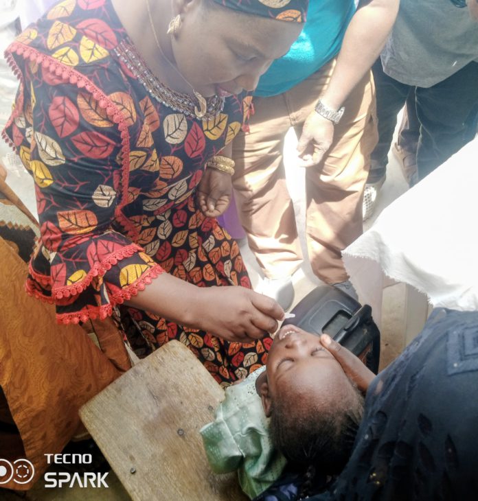 Yola North LG vice chairman, Sarah Nathan administering the two doses of the vaccine on a child during the flag off of the campaign in Yola North on Sunday.