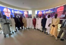 A group pic of Kwankwaso with members of the movement on Thursday in Abuja.