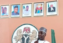 The chairman alongside other critical stakeholders making a point marking activities for the celebration of 100 days in power.