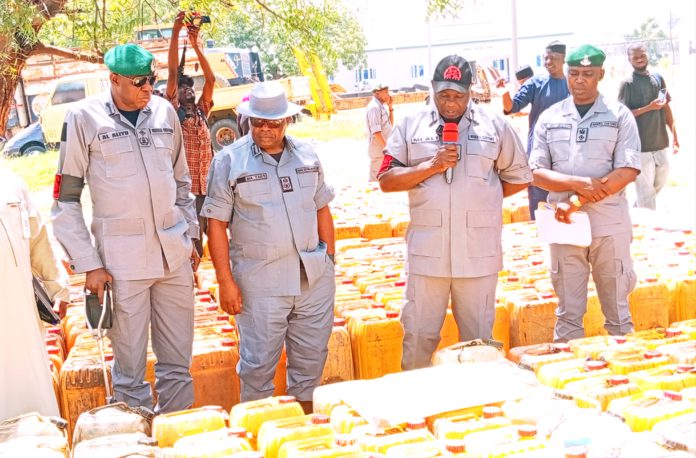National coordinator of operation whirlwind, inspecting seized PMS at Customs house Yola on Wednesday.